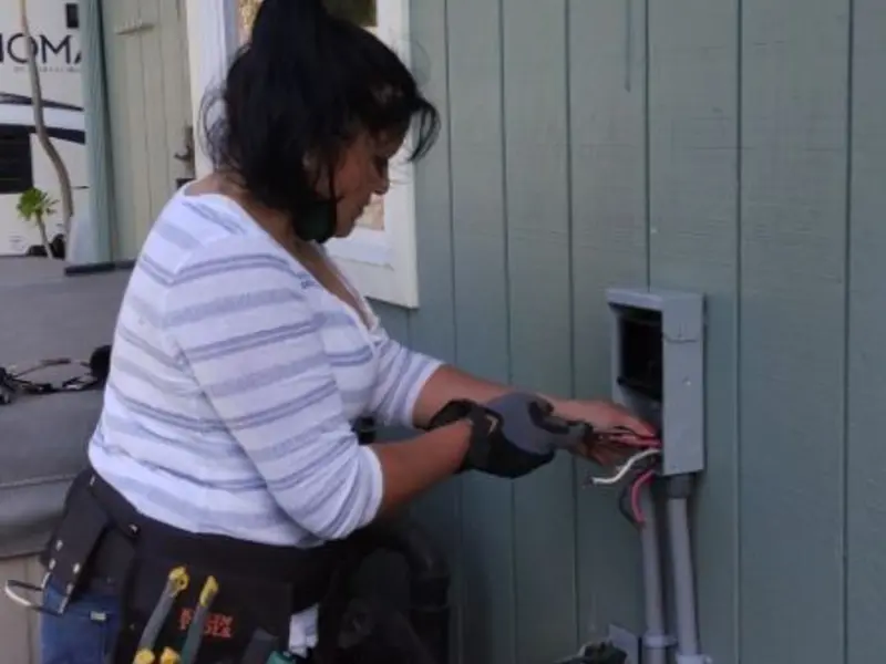 Licensed electrician wiring an exterior subpanel in Perry Hall